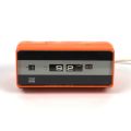Retro orange and black ITT NOVA alarm clock from the 1970s, not in working condition