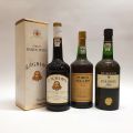 A selection of 3 bottles of port: white, tawny, and Ramos Pinto