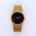 Ladies' wristwatch in 18ct gold, black dial and gold hands