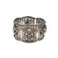 Bracelet en argent 800 filigrané, panneaux articulés et motifs en relief, TBE