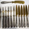 Elegant set of dessert cutlery with silver handles