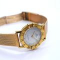Montre Omega en or jaune de 1991, modèle rond, mouvement quartz