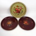 Set of 4 painted sheet metal trays with floral designs, early 20th century