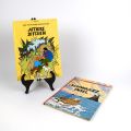 Reunion of two albums by Hergé: D'Affaire Ditchen and D'schwaarz Insel