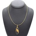 Ras de cou en or 18ct avec citrine et médaillon décoré d’un héron