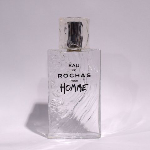 EAU DE ROCHAS : Flacon géant en plastique et plexiglass, hauteur 35 cm