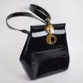 Sac à dos vintage Christian Dior en cuir verni avec usures
