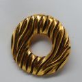 Broche vintage en plaqué or Yves Saint Laurent des années 80