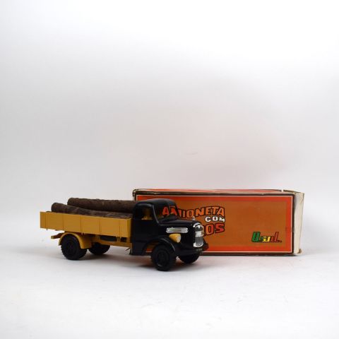 Camion en plastique Hanomag noir et jaune, benne basculante, bon état, avec boîte