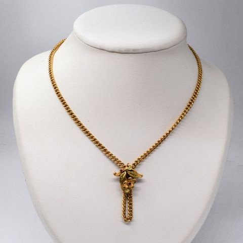 Collier en or 18 carats avec boucle sculptée de fleurs et tourmalines serties