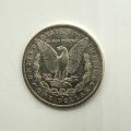 1884 Morgan Dollar (O) in silver, encapsulated, in fine condition