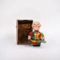 Mechanischer Clown aus lithographiertem Blech, mit Glocke und Schild "Circus".
