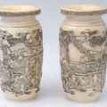 Pair of small engraved ivory urns
