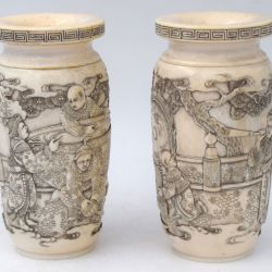 Pair of small engraved ivory urns