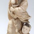 Ivory Okimono with a dancer and his son