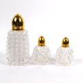 Cut-glass set: shaker, salt and pepper shakers, gold frame, West Germany