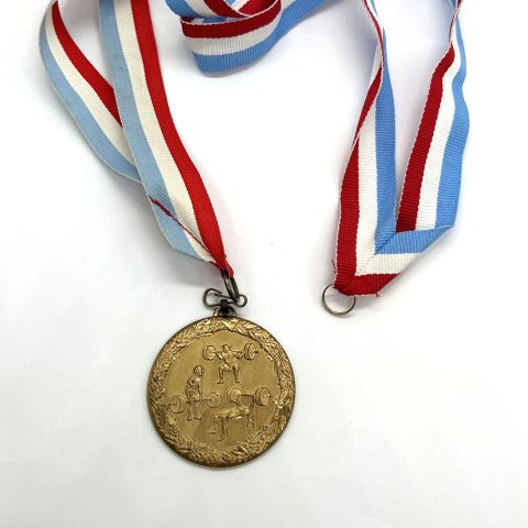 Médaille Grand Prix 1998 : Bench Press en bronze doré avec ruban tricolore