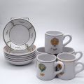 Service de tasses Moustiers Ségriès décor montgolfières, signées sous la base