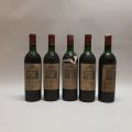 Quintette de bouteilles Château Citran, millésimes 1973 et 1974, niveaux bas goulot