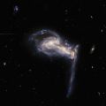 (NASA. GRAND FORMAT. TELESCOPE HUBBLE) Système galactique Arp 195