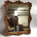 Miroir Louis XV en bois doré, début XXe siècle, élégant et classique