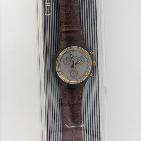 SWATCH SCM 100 : Modèle "CHRONO GOLDFINGER", 1991