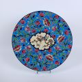 Grande assiette en émaux décor florial et oiseaux, fond bleu, Longwy
