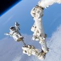 Astronaut Robinson on a spacewalk, impressive view of Earth, 2005