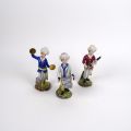 Personnages musiciens en porcelaine : cymbaliste, clarinettiste, joueur de tambour Xxe
