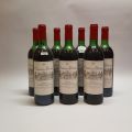 Seven bottles of Château de Portets, Red 1975, filled to the shoulder