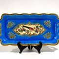 Plat à gâteau Longwy en émaux bleus et dorés, décor paon/faisan, signé